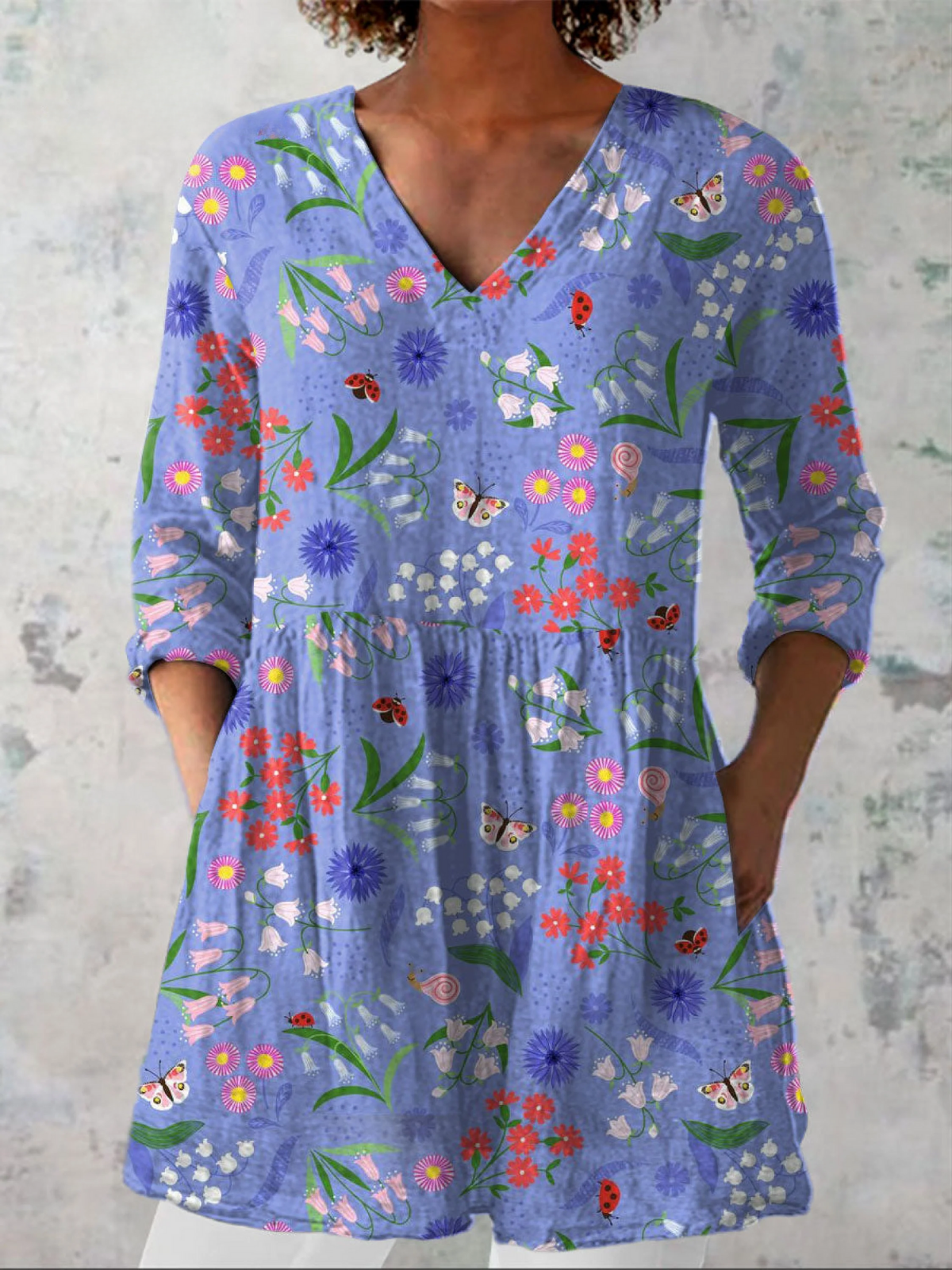 Aline soft blue floral V-neck blouse in Purple, front view