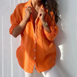 Bela breezy crinkle button blouse in Orange, front view