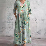 Maya floral summer dress in Green, front view