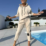 Olyra two-piece hoodie and jogger set in Apricot, front view