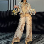 Elyra printed satin overshirt and trouser set in Beige, front view