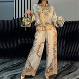 Elyra printed satin overshirt and trouser set in Beige, front view